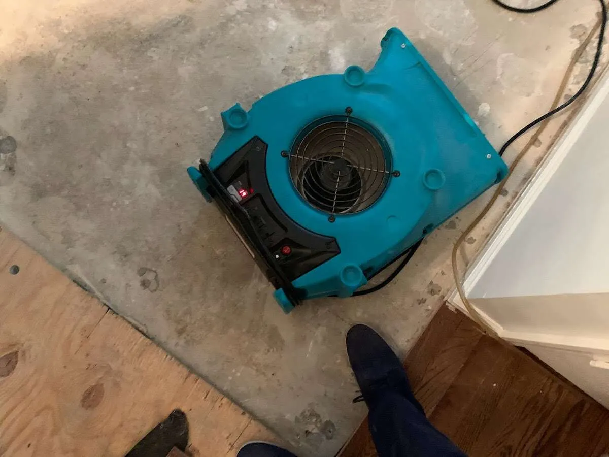 Air mover drying subfloor during Commercial Water Damage Restoration in Lake Wylie